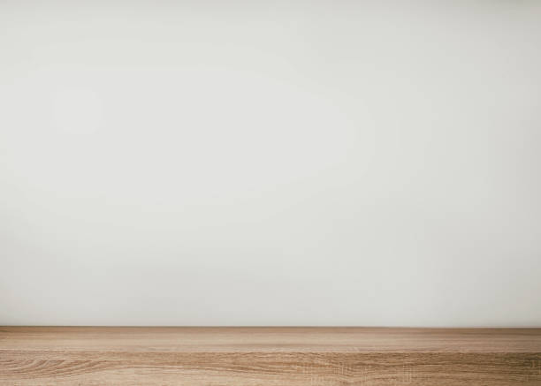 istock Empty wood table top and blur wall. Wall Texture Background. Building banner mock up abstract background - can used for display or montage your products 1363956508