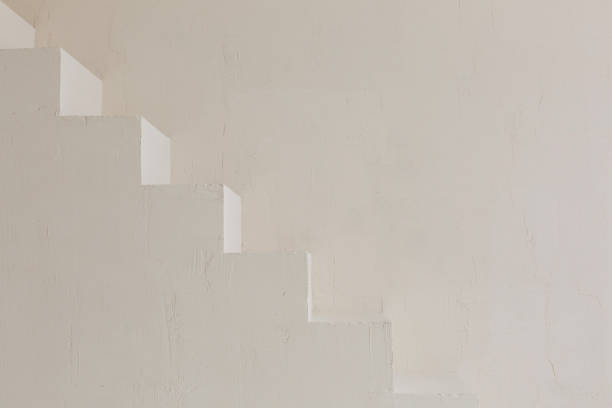 istock Minimalistic plain stairway. Light color indoor architecture element. Texture background for business posters. 1363959912