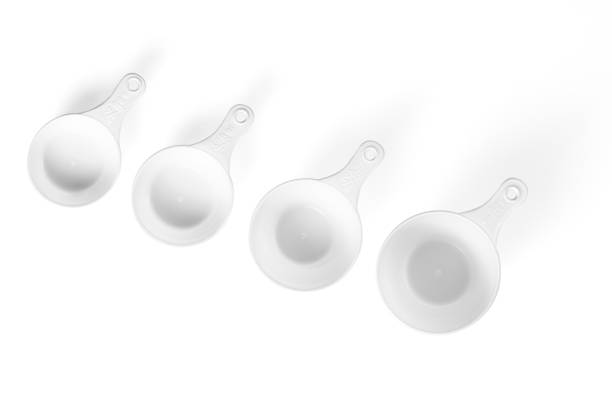 istock Set of measuring cups lined up, top view, white background 1363961431
