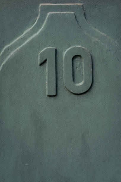 istock Even number ten, 10, in weathered green colour with copy space. 1363962369