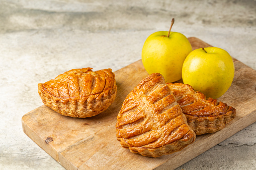 Apple turnovers, or chaussons aux pommes are a classic French puff pastry that is filled with apple sauce.