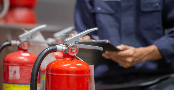 istock Engineer are checking and inspection a fire extinguishers tank in the fire control room for safety training and fire prevention. 1363964561