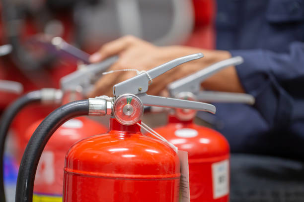 istock Engineer are checking and inspection a fire extinguishers tank in the fire control room for safety training and fire prevention. 1363964601