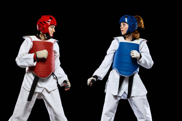 https://media.istockphoto.com/id/1363966495/photo/dynamic-portrait-of-two-young-women-taekwondo-athletes-training-together-isolated-over-dark.jpg?s=612x612&w=0&k=20&c=yt0vfIVBW2m8IGSlArvATpkKpAj-UVl8CkHdRenNTCw=