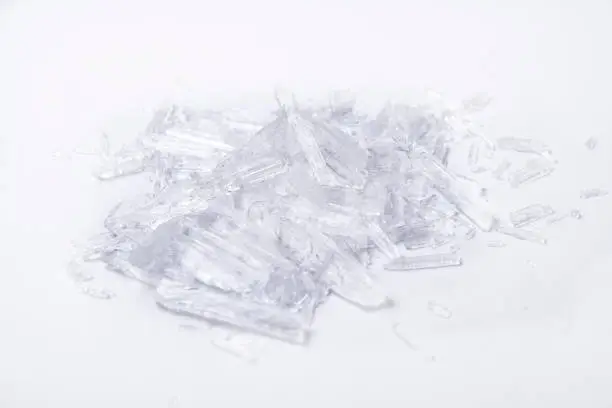 translucent menthol crystals on a white background