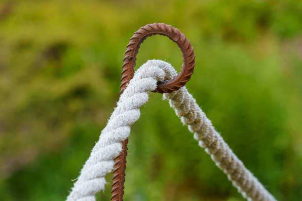 istock Selective focus on rope fence barrier with green background. 1363972924