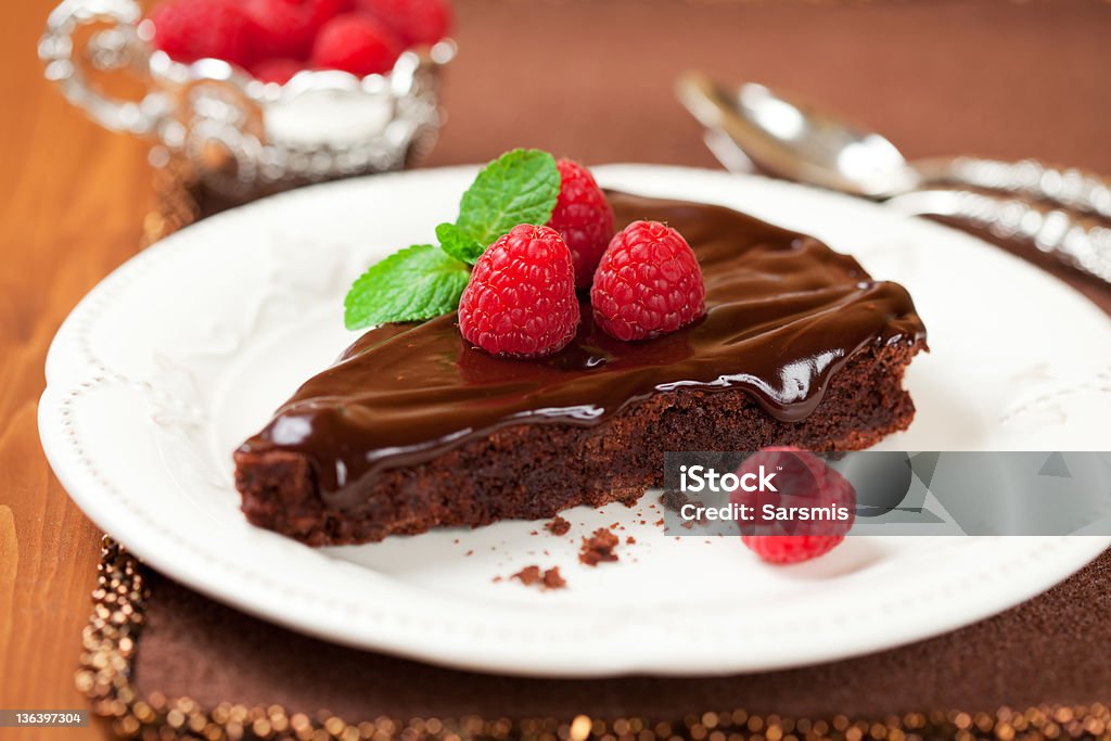 chocolate cake with raspberry slice of chocolate cake with raspberry Baked Pastry Item Stock Photo