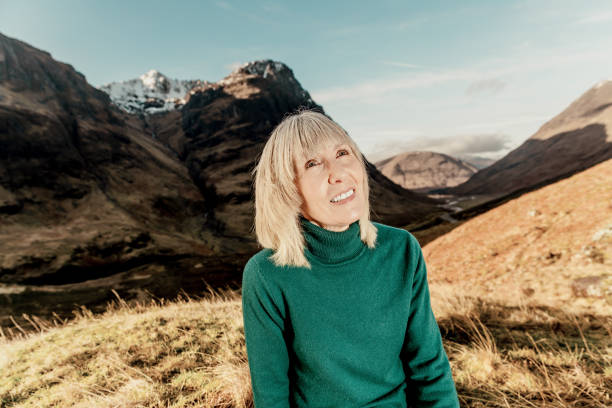 istock Woman relaxing in Glencoe Scotland 1363973146