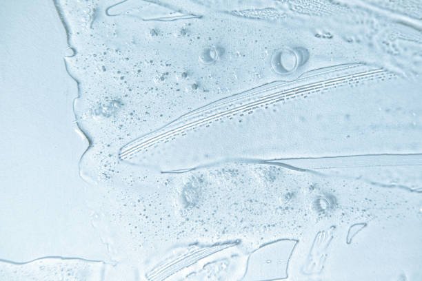 istock Bubble gel texture. Natural gel texture. Transparent liquid gel spot on blue background. Textured smear with oxygen bubbles. Clear liquid gel bubbles texture. Face serum, hand santizer swatch 1363973241