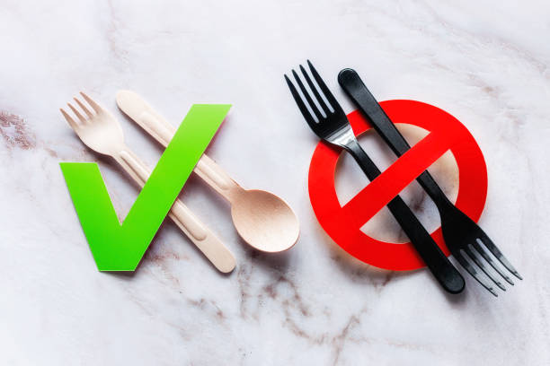 our choice is cutlery made of wood and the ban on plastic - disposable imagens e fotografias de stock