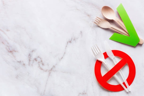 istock cutlery made of wood and plastic concept stop plastic non-degradable materials 1363974467