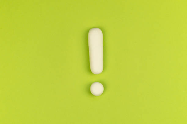 Exclamation mark on a green background. Warning sign, keep attention concept. The alarm about important information.