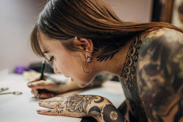istock Female tattoo making a stencil 1363977941