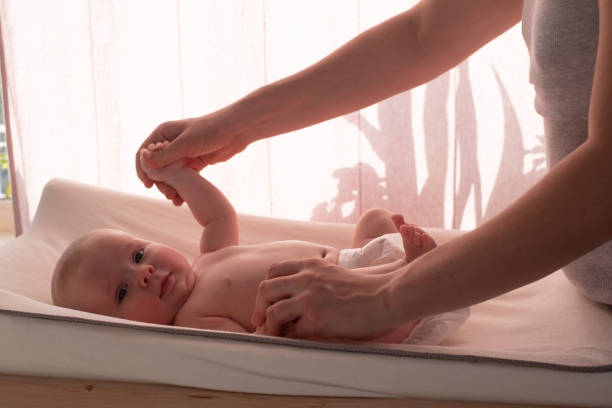 istock Mother massaging her child hands at home 1363977949