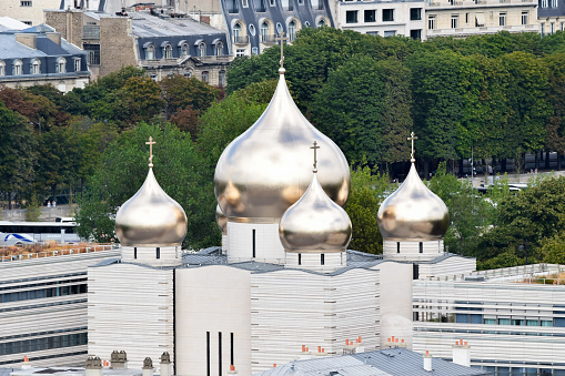 Bulbous and gilded domes of classical and Byzantine style of the Cathedral of the Holy Trinity in Paris, France