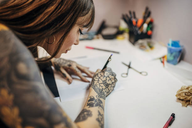 istock Female tattoo making a stencil 1363978109