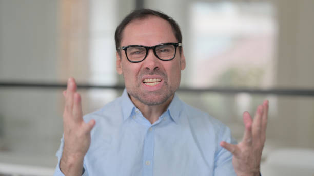 istock Portrait of Angry Middle Aged Man Fighting, Arguing 1363978143