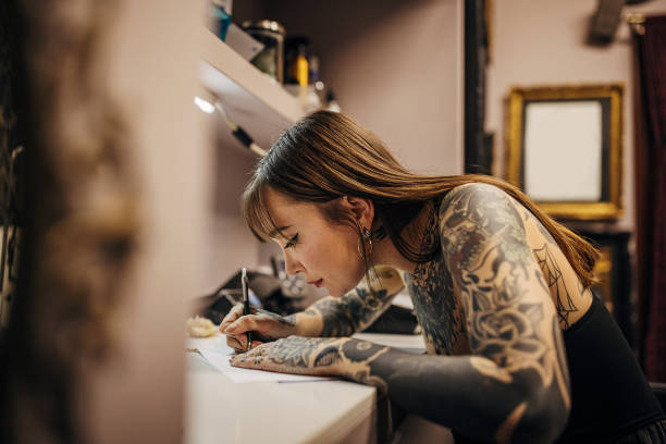 istock Female tattoo making a stencil 1363978164