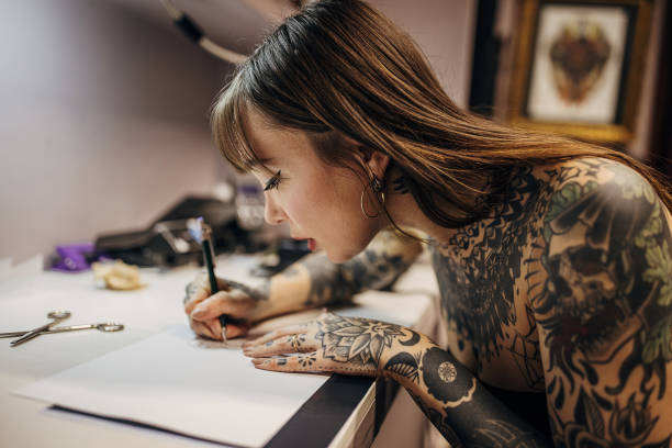 istock Female tattoo making a stencil 1363978361