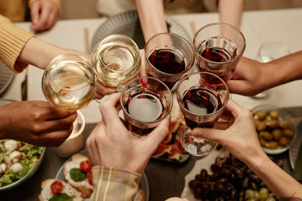 istock People toasting with glasses of wine 1363979803