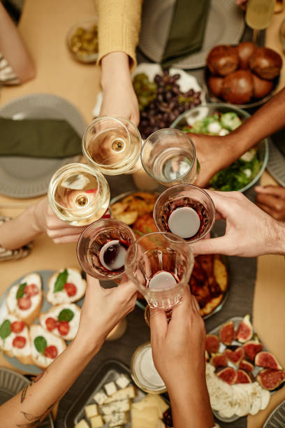 istock People toasting with wine and champagne 1363979837
