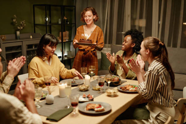 istock Friends congratulating friend with birthday 1363979849