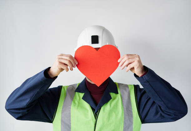 Construction worker with red heart as Valentine's Day symbol