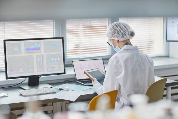istock Woman working on digital tablet at the lab 1363985397