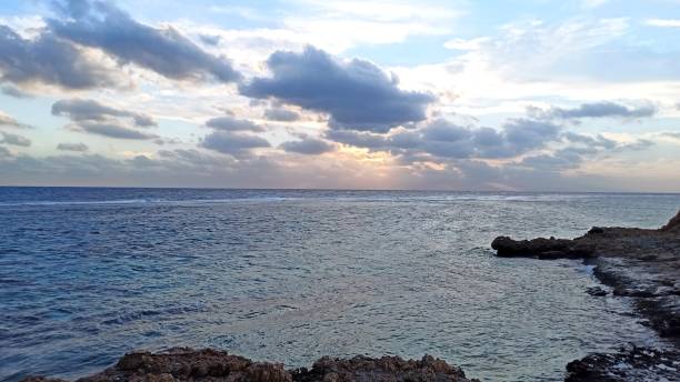 istock Dawn on the rocky seashore. 1363985829
