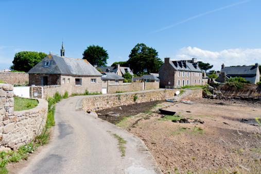 Local road by ebb tide at the smallest point of Ile de Brehat in Brittany, France