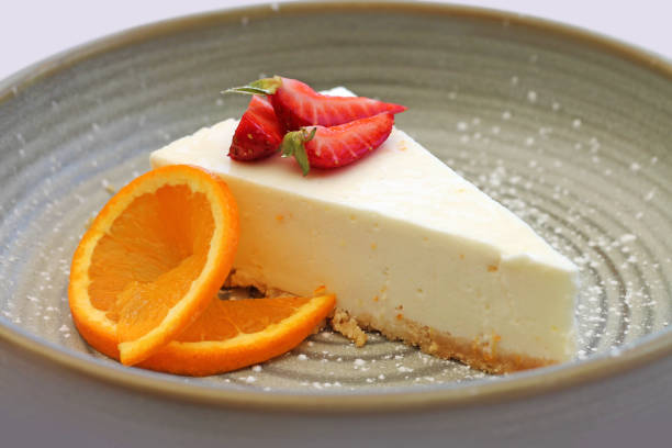 istock Cheesecake with fruits at plate close up. 1363987617