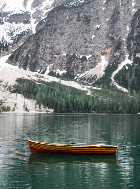 istock Beautiful little rowing boat in front of a mountain 1363990314