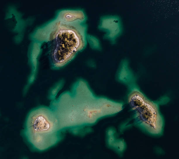 istock Island in turquoise water in lake 1363990416