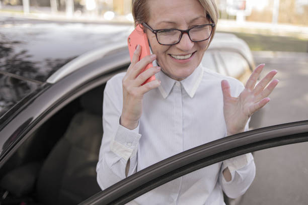 istock Happy mature woman talking on mobile phone 1363991075