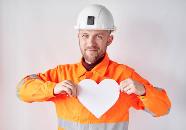 istock Valentine's Day concept: male worker with white heart 1363991514