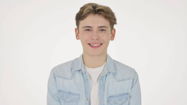istock Young Man Smiling at Camera on White Background 1363992639