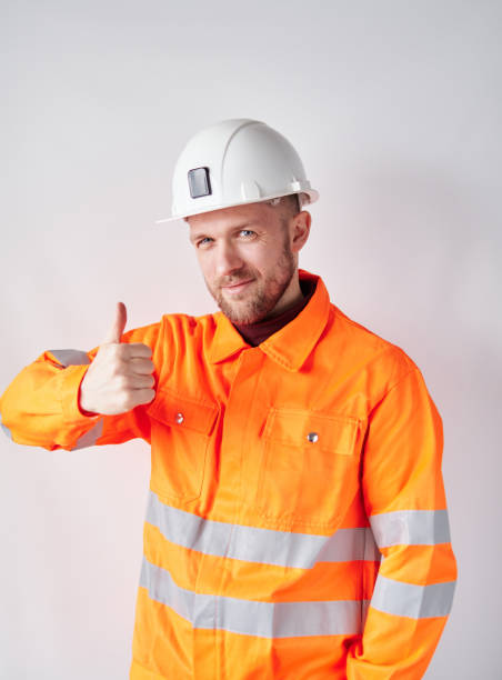istock Male in worker uniform and hardhat making thumbs up gesture 1363992686