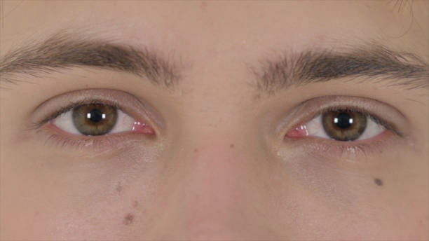 istock Blinking Eyes of Young Man 1363992851