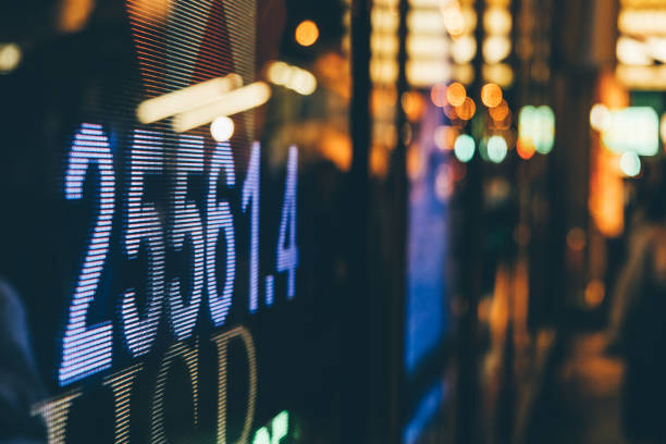 Financial stock market numbers and city light reflection stock photo