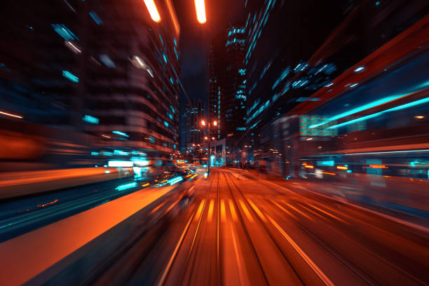 istock blurred Motion Speed Light Tail with Night City Background 1363993186