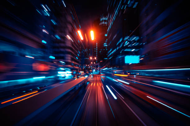 istock blurred Motion Speed Light Tail with Night City Background 1363993263