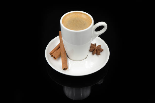 istock Black coffee in a cup on a black glass background. 1363994201