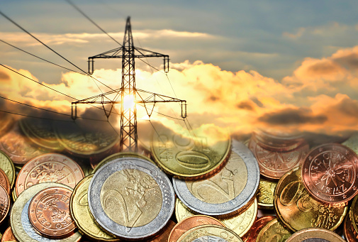 High voltage power line in connection with euro coins.
