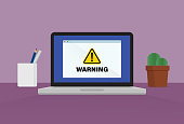 istock Warning sign on a laptop 1363994776
