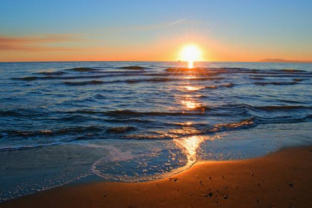istock Colorful sea beach sunset with soft waves 1363999341