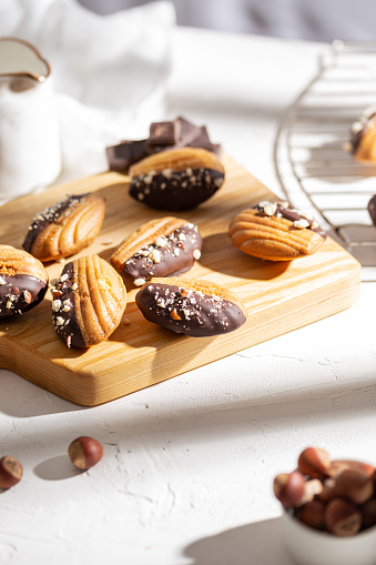 Vanilla madeleine cookies with chocolate and nuts