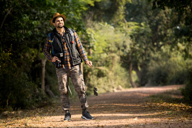istock Male hiker admiring nature in forest 1364005370