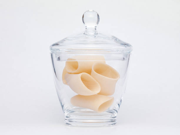 istock Pasta in glass jar on a white background 1364005558
