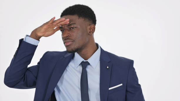 istock African Businessman Looking Around, Searching on White Background 1364007615