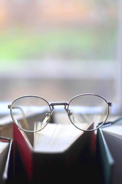 Hardcover Books and Reading Glasses
